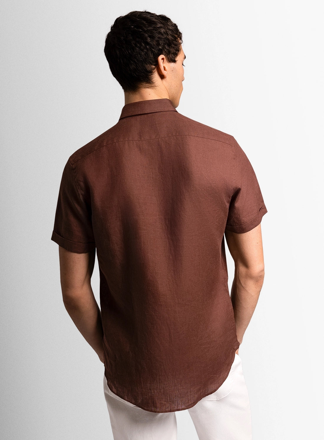 Brown dress shirt with a Peter Jackson label on a white background