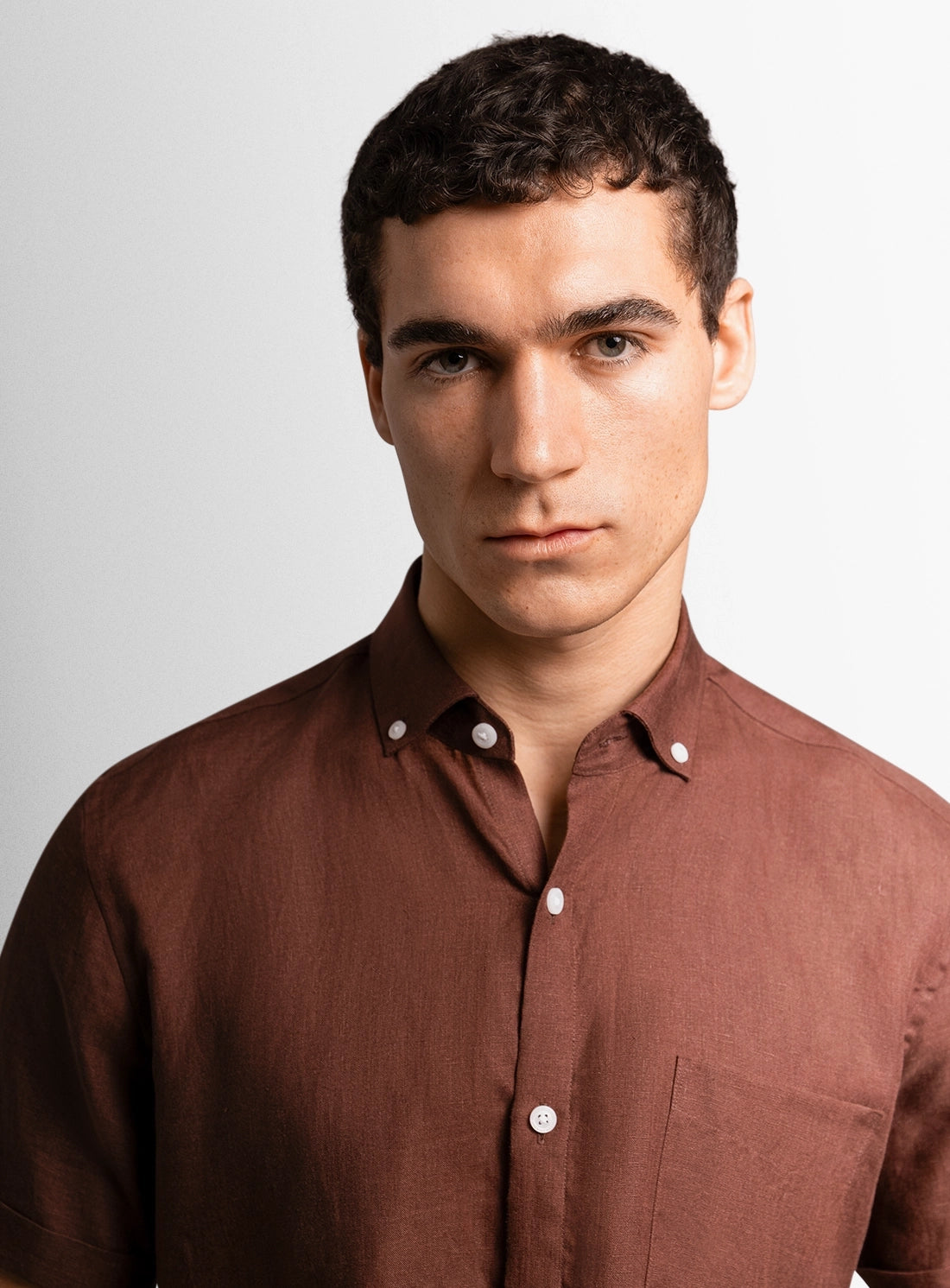 Brown dress shirt with a Peter Jackson label on a white background
