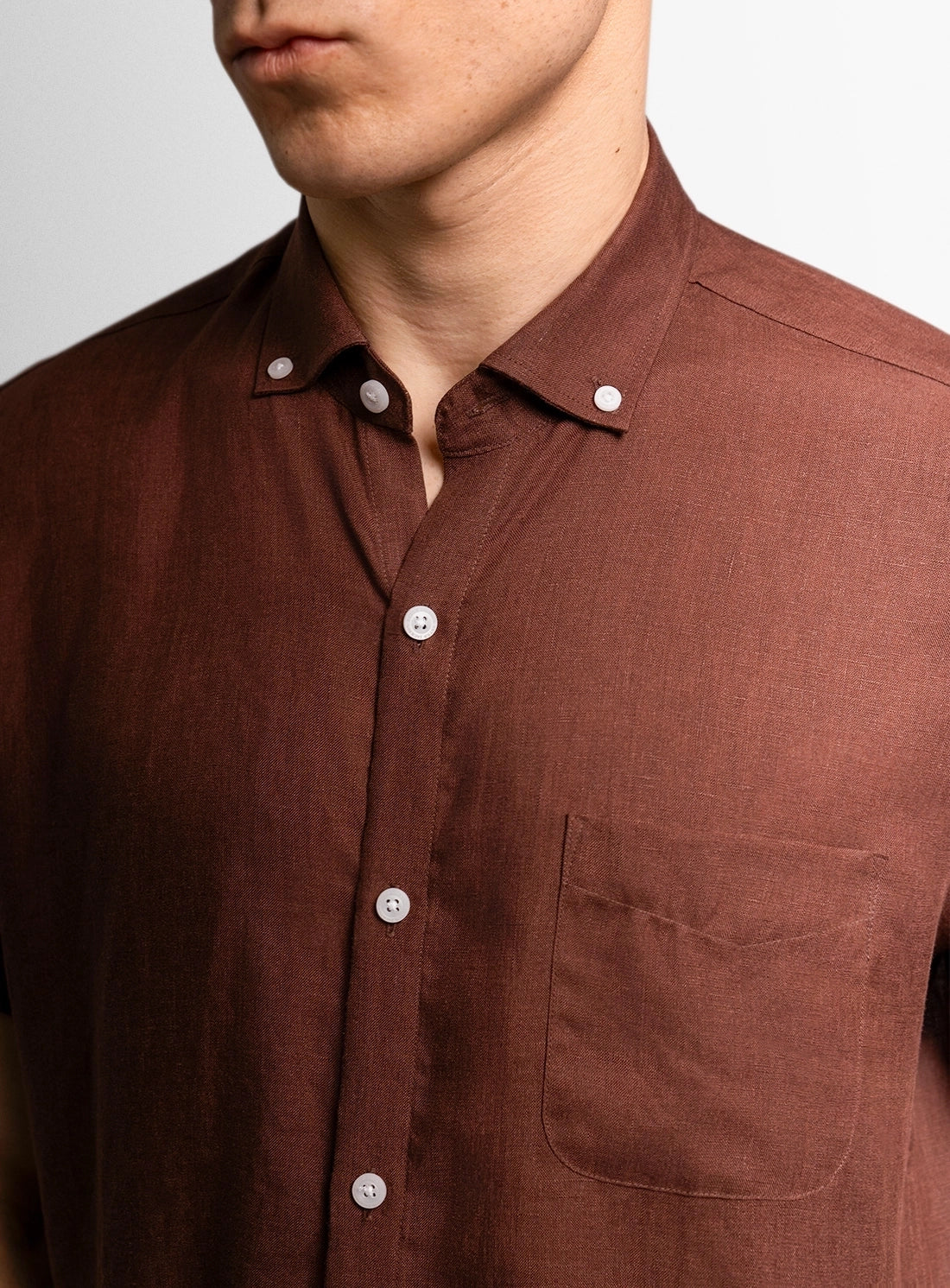 Brown dress shirt with a Peter Jackson label on a white background