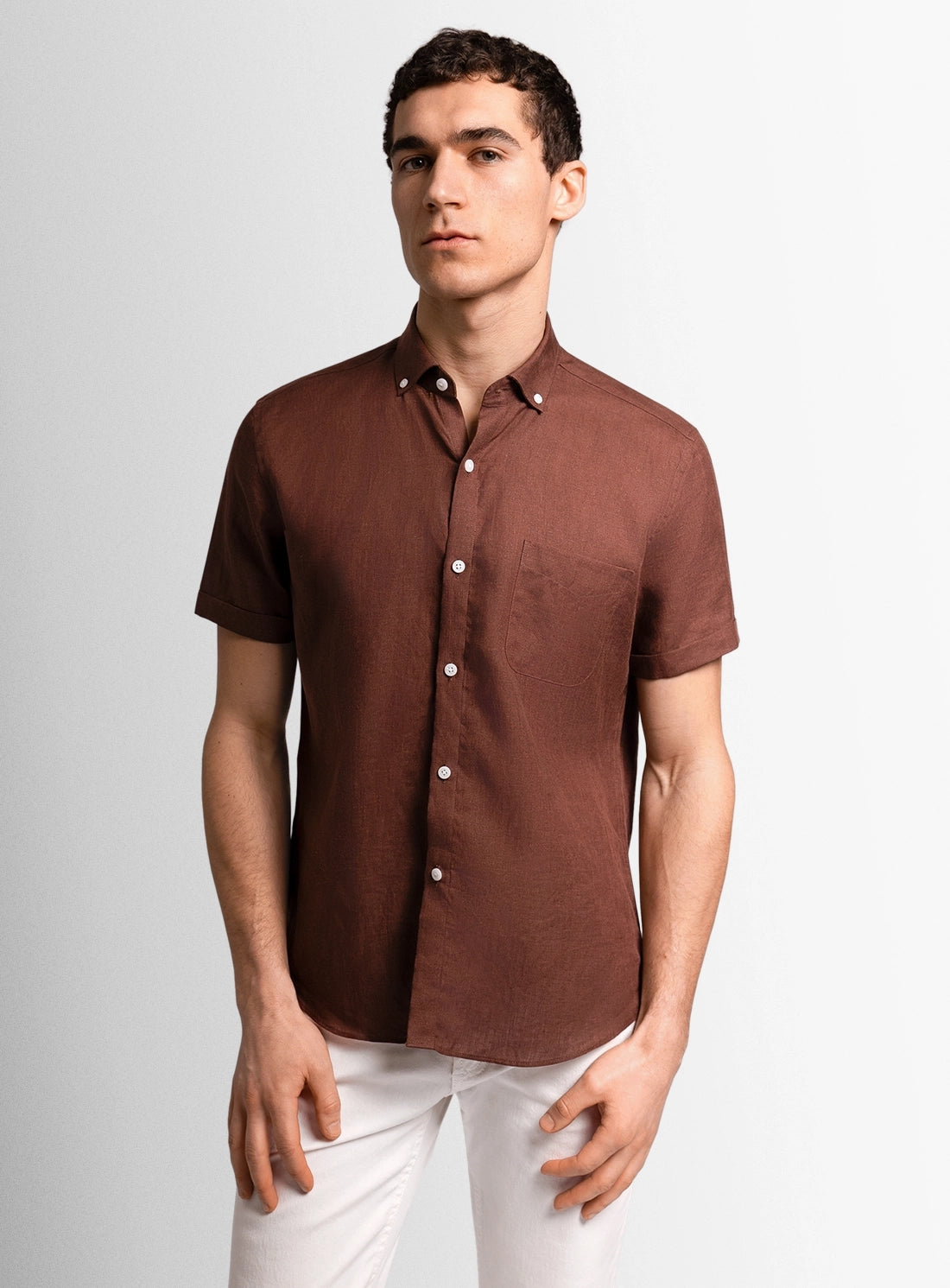 Brown dress shirt with a Peter Jackson label on a white background