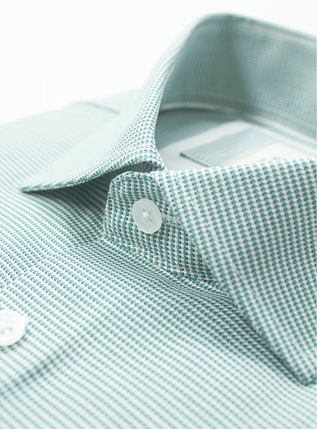 Green dress shirt with a Peter Jackson label on a white background