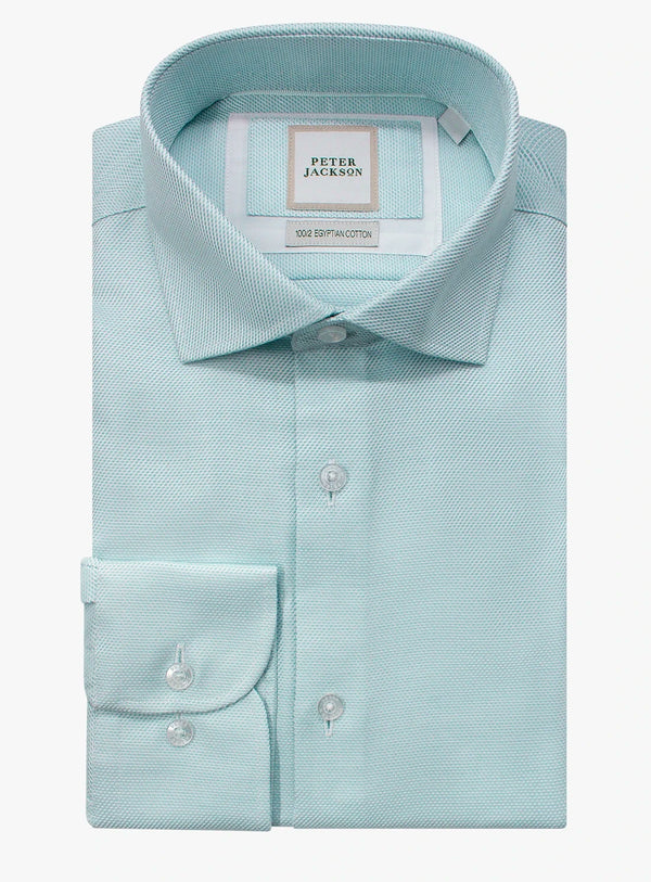 Light blue dress shirt with collar and cuff details on a white background