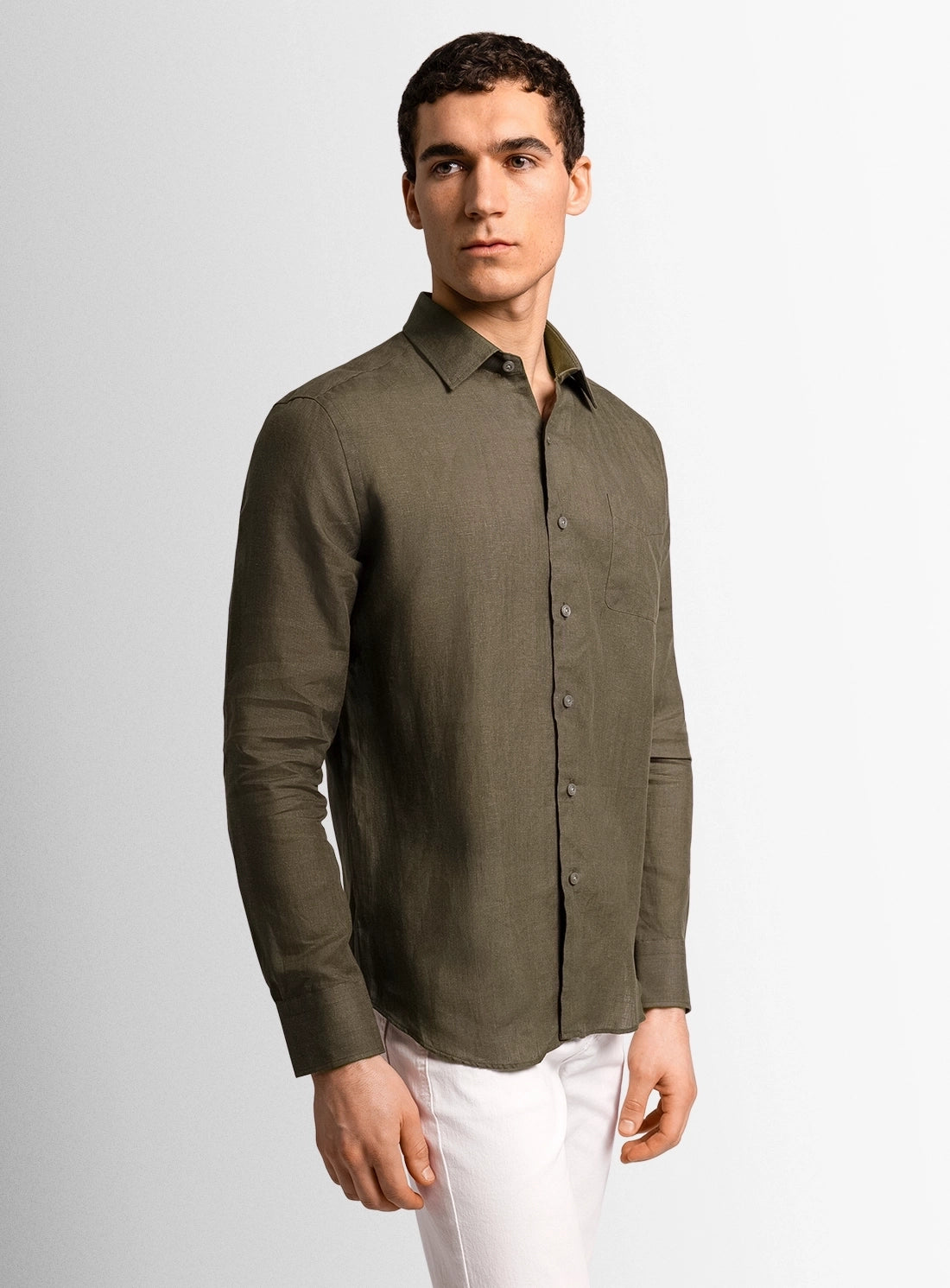 Green dress shirt with a Peter Jackson label on a white background