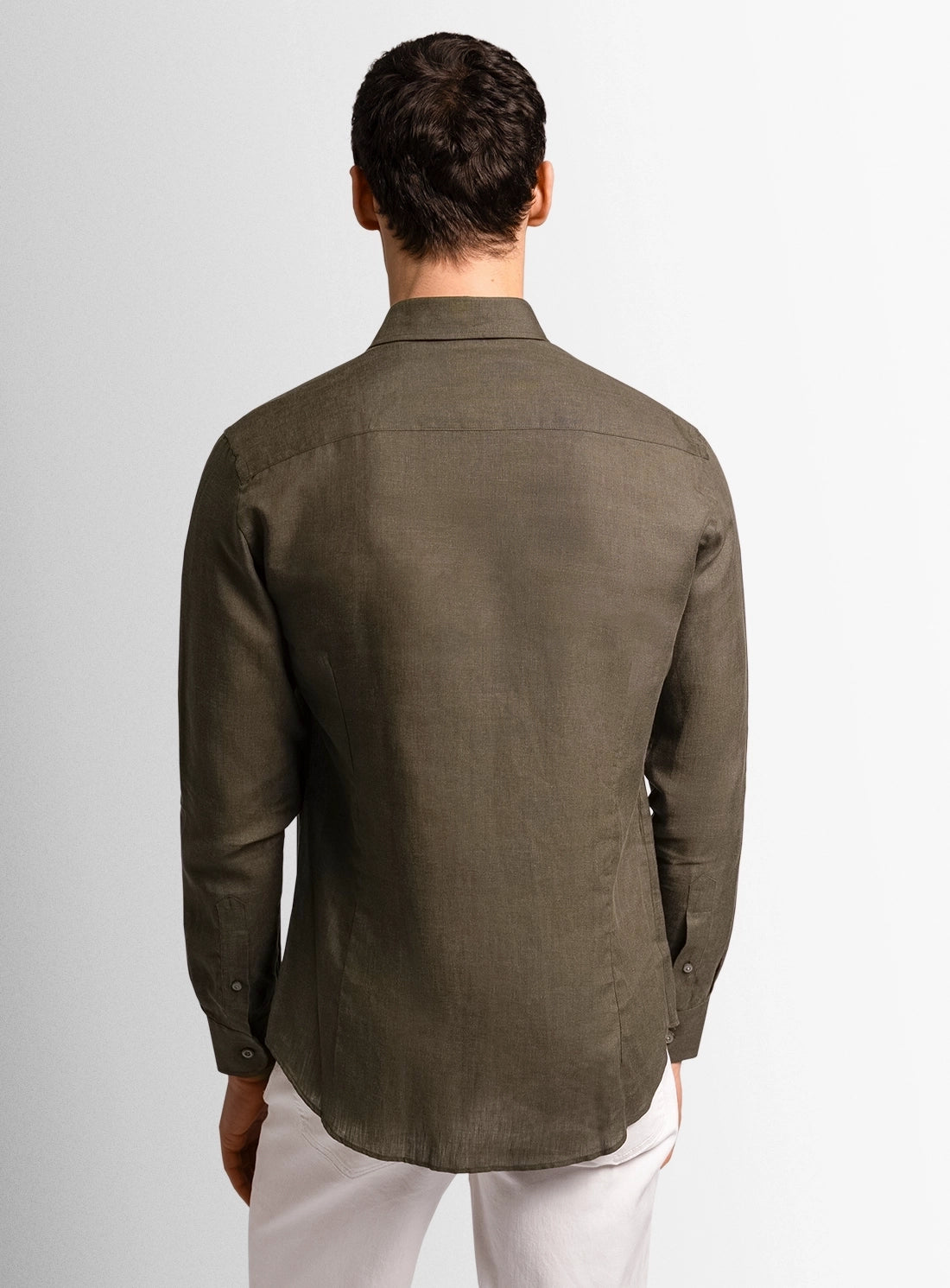 Green dress shirt with a Peter Jackson label on a white background