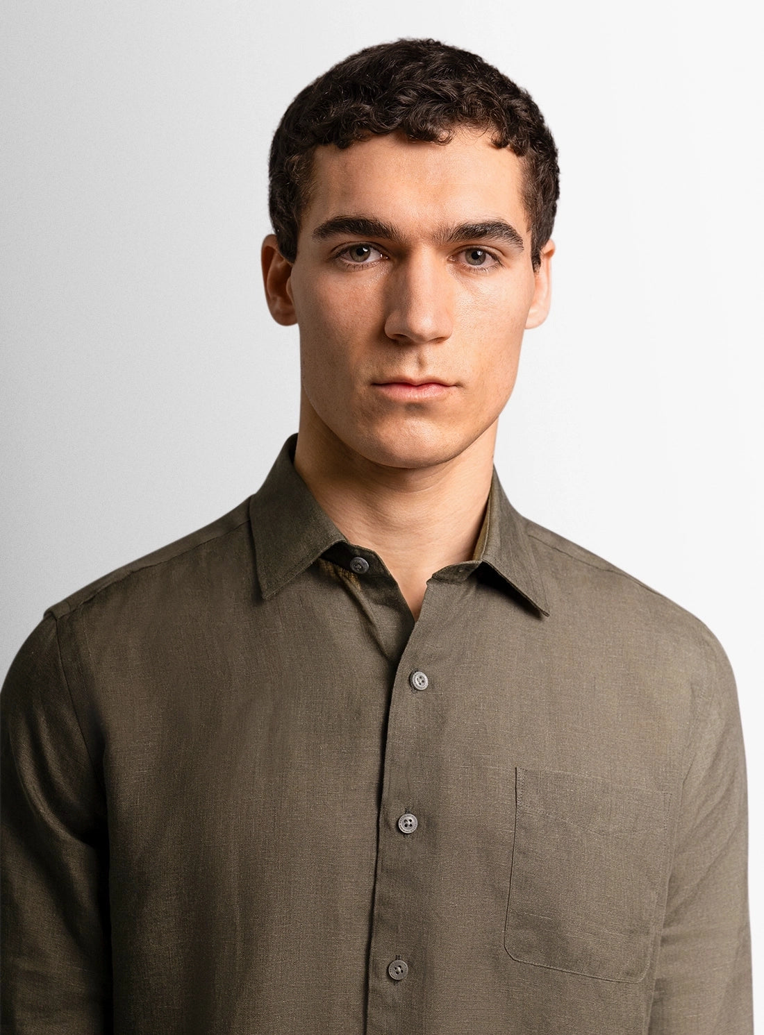 Green dress shirt with a Peter Jackson label on a white background