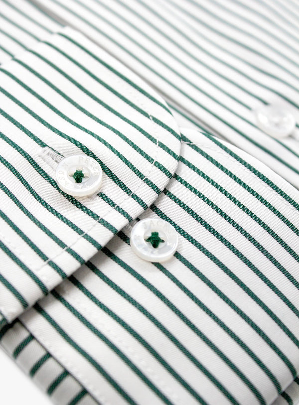 Close-up of a green and white striped shirt with buttons.