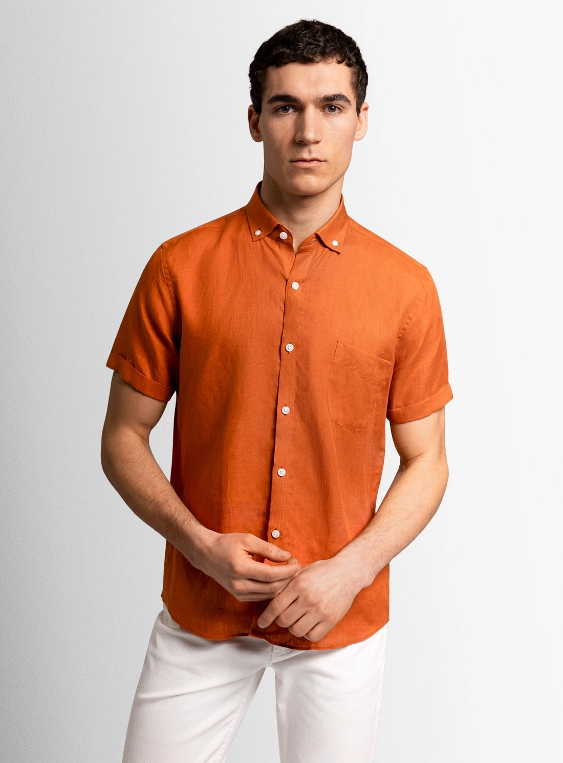 Orange dress shirt with a Peter Jackson label on a white background