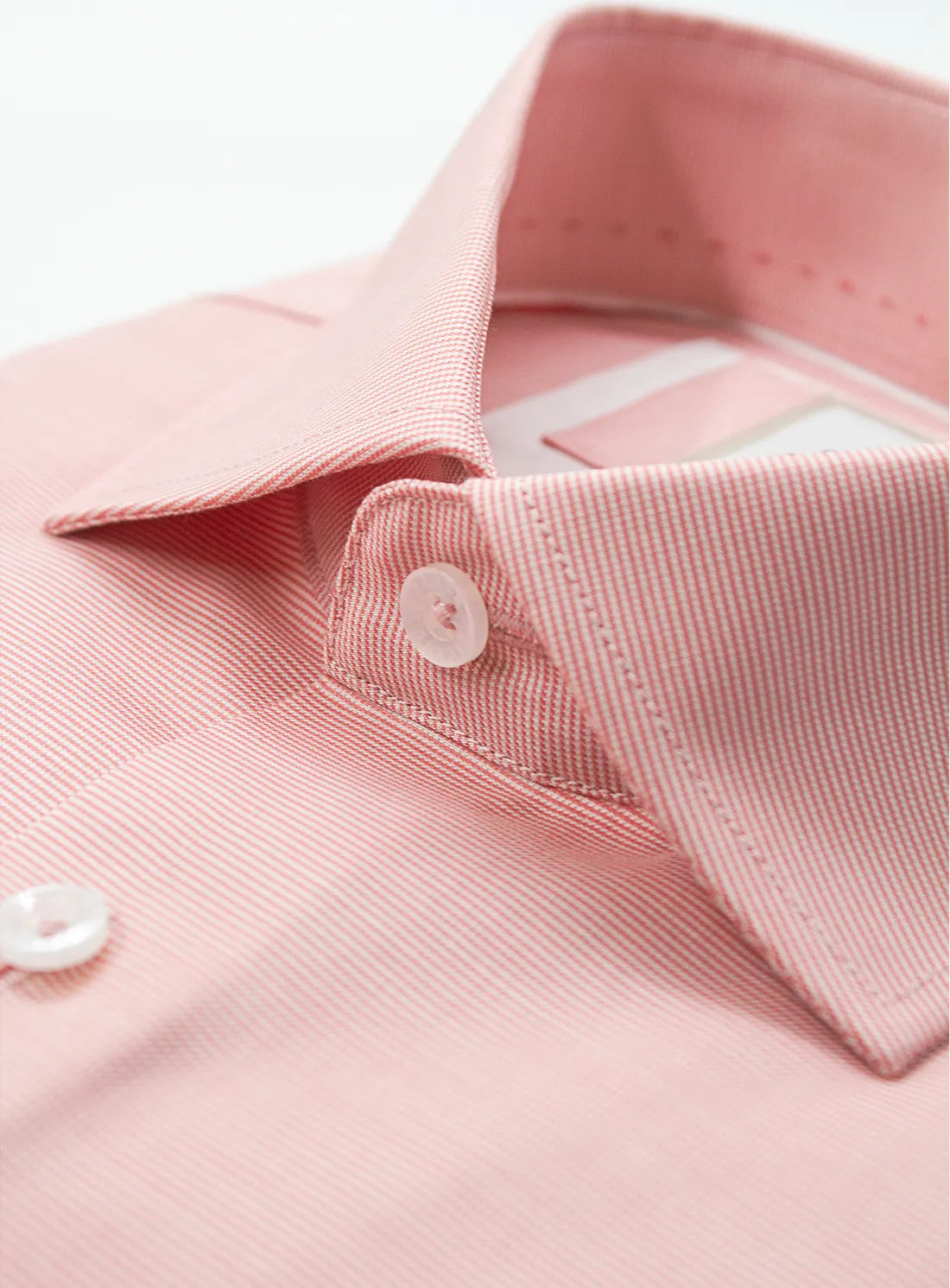 Orange dress shirt with a Peter Jackson label on a white background