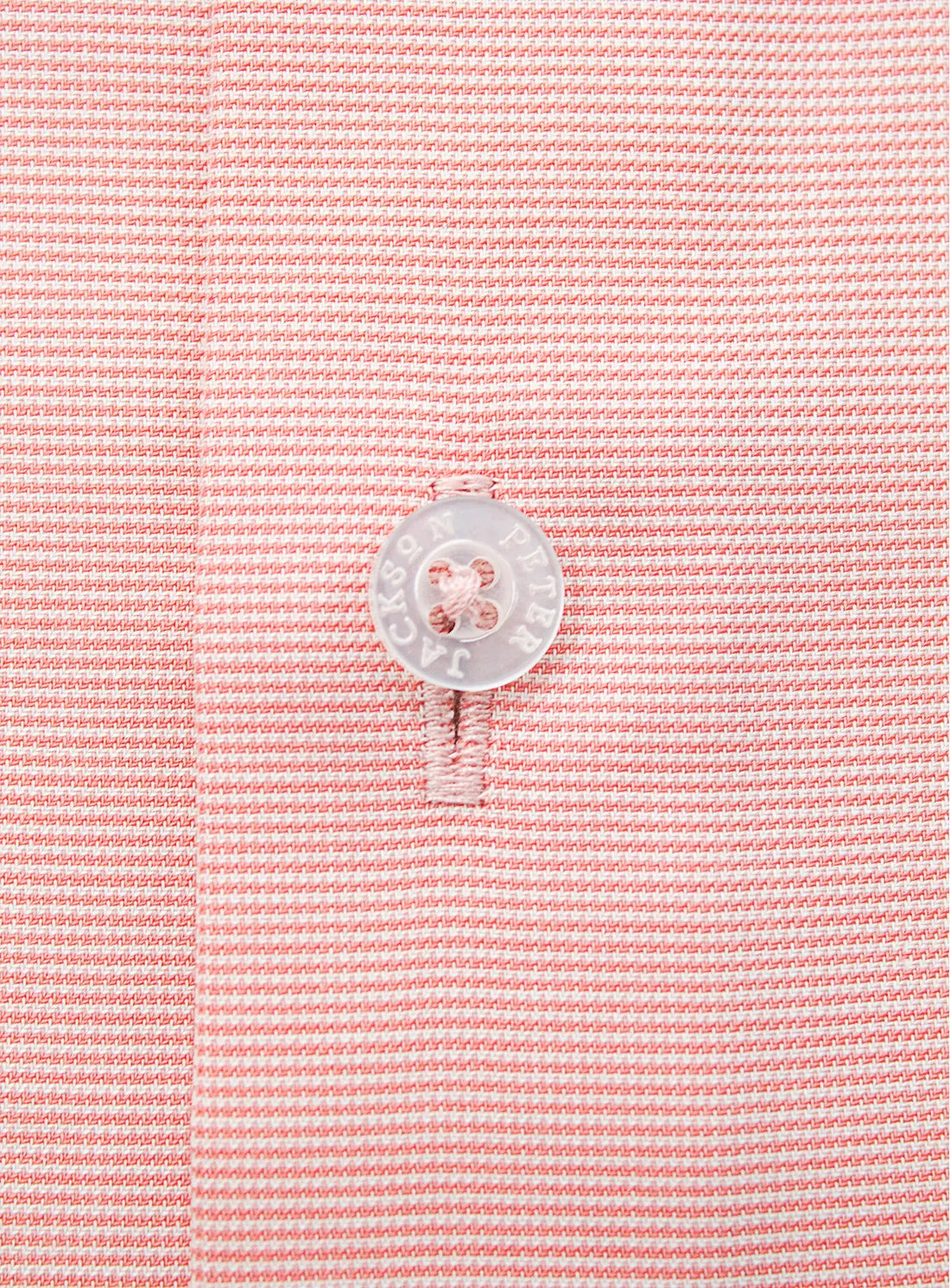 Orange dress shirt with a Peter Jackson label on a white background