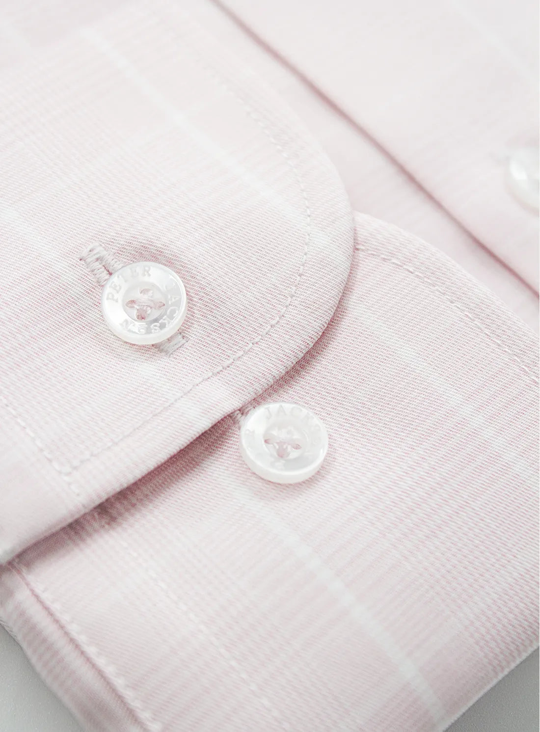 Pink dress shirt with a Peter Jackson label on a white background