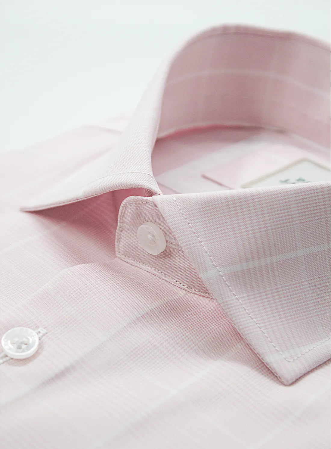 Pink dress shirt with a Peter Jackson label on a white background
