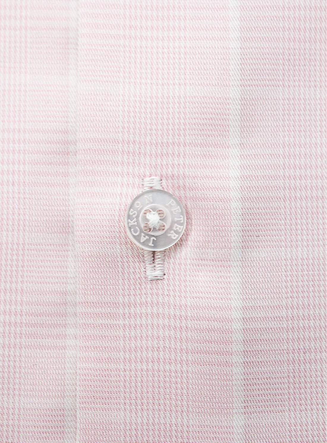 Pink dress shirt with a Peter Jackson label on a white background