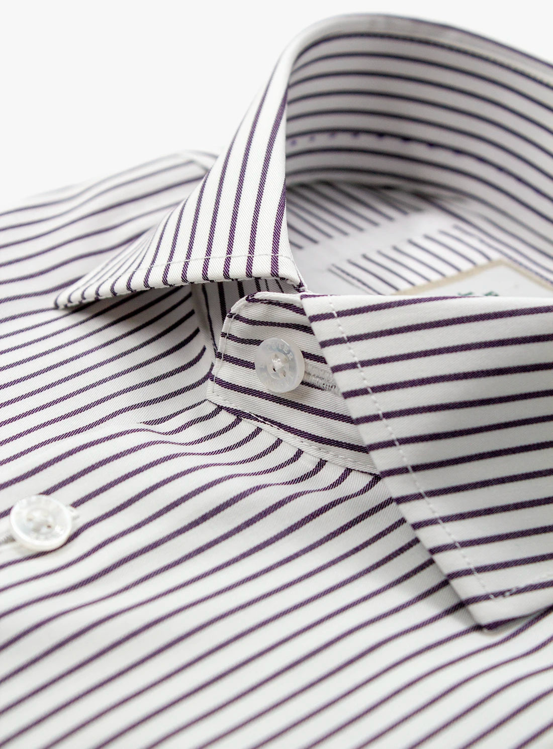 Close-up of a striped shirt with a button