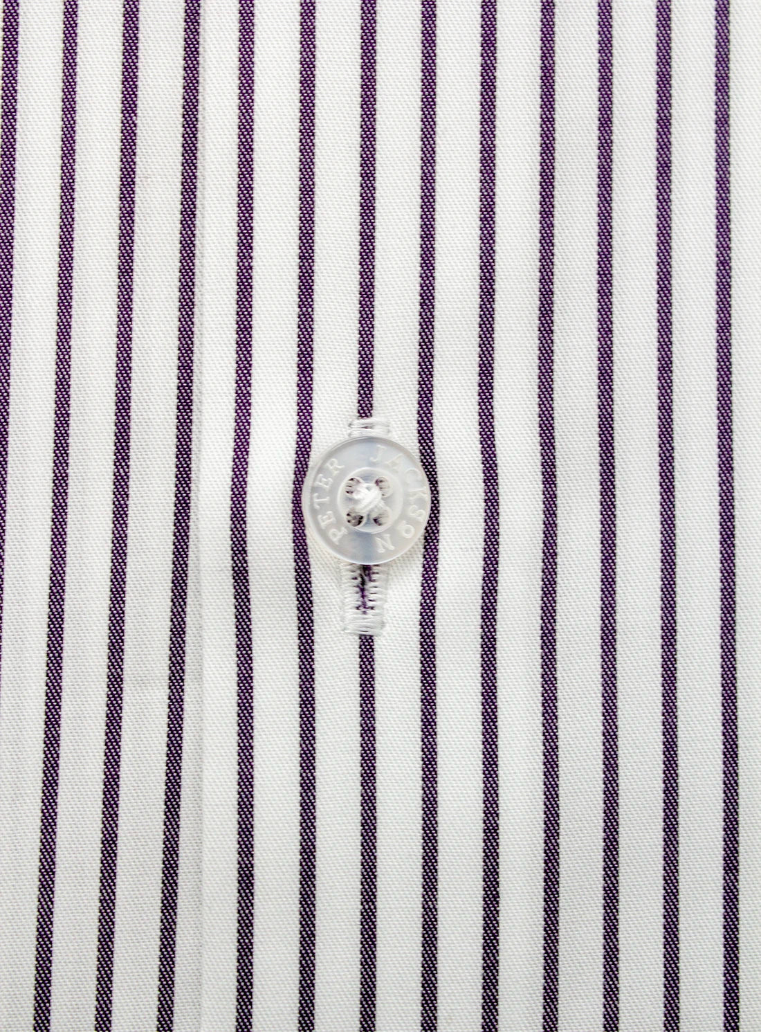 Close-up of a shirt with purple and white vertical stripes and a button.