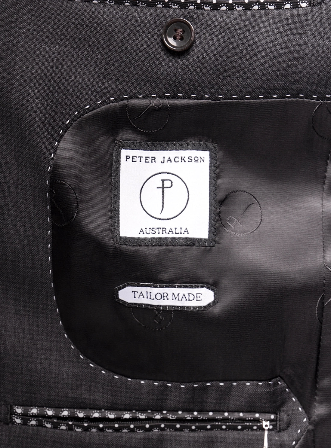 Close-up of a garment with 'Peter Jackson Australia' label and 'Tailor Made' text.