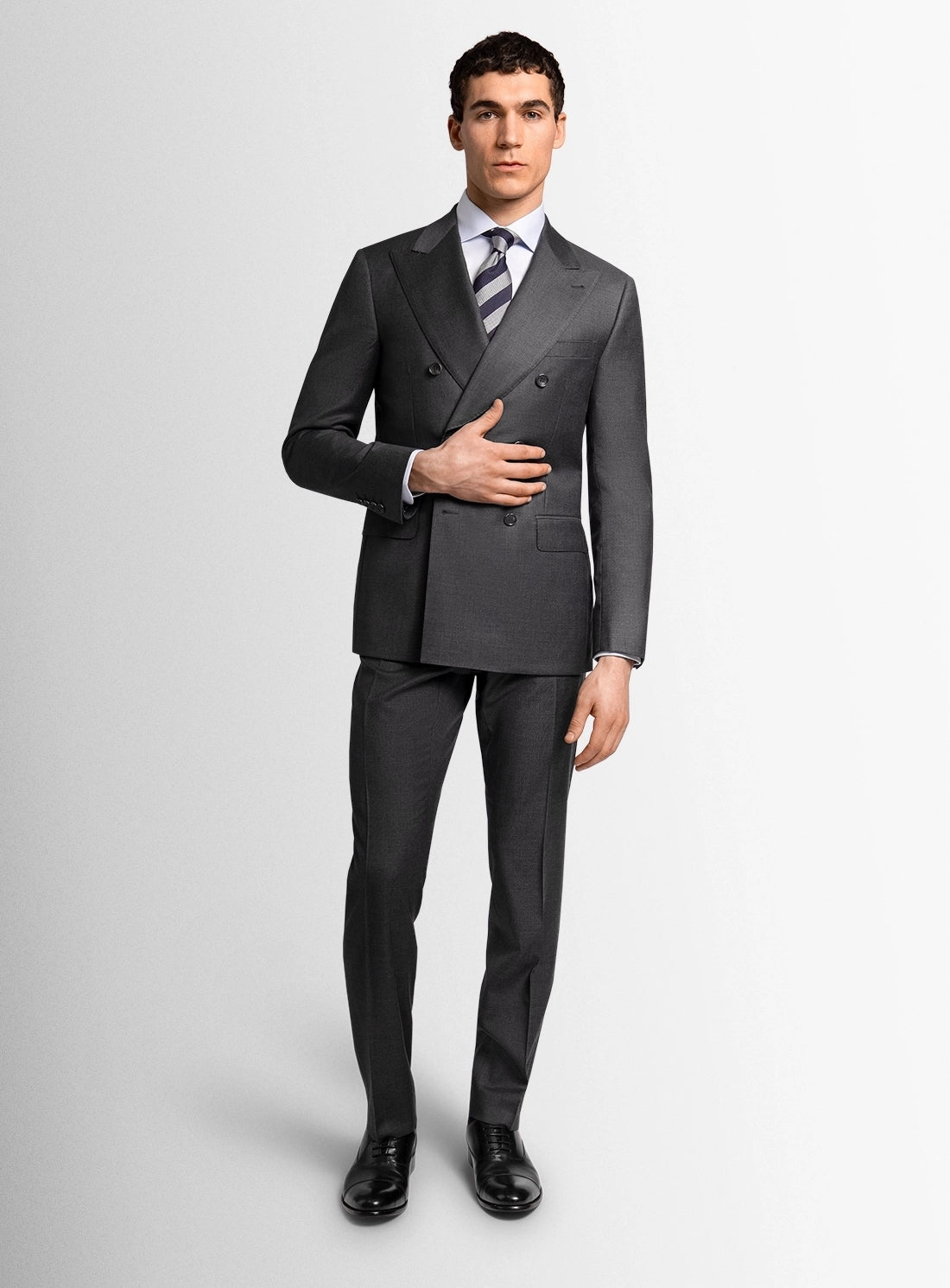 Man wearing a gray suit on a white background