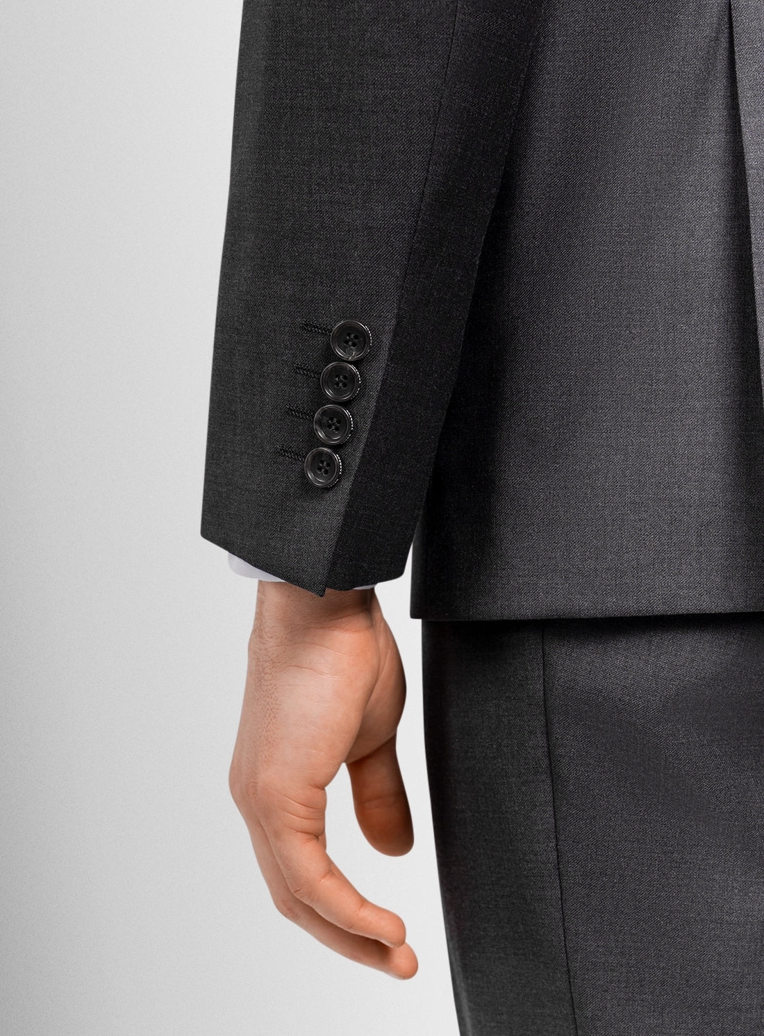 Gray suit jacket with buttons on a light gray background
