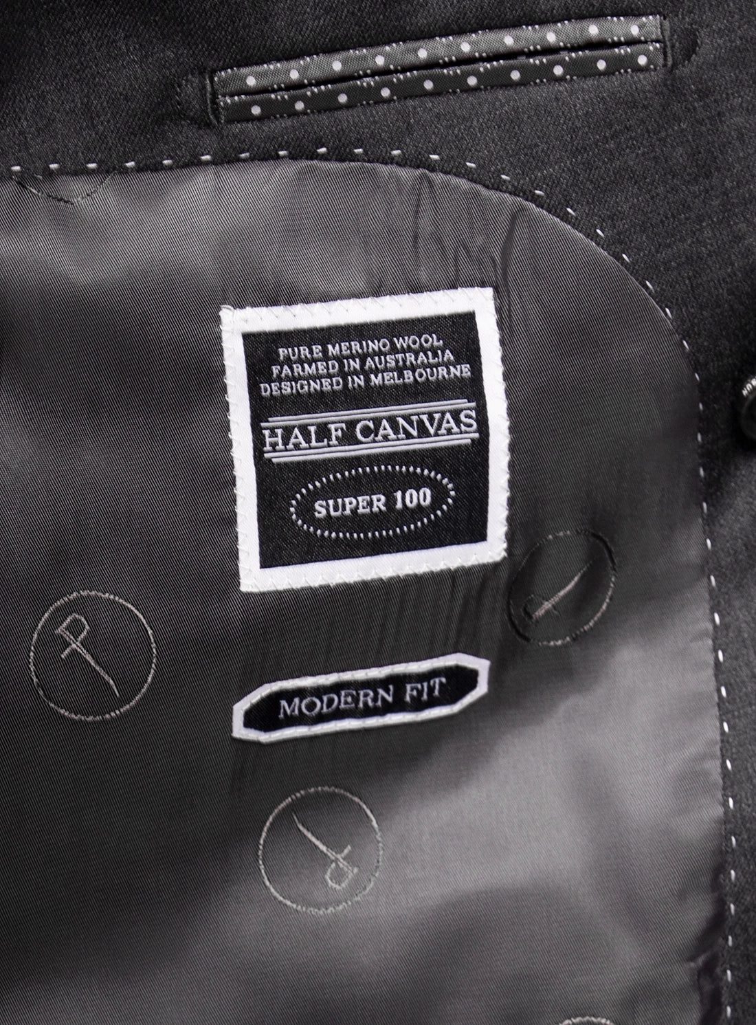 Close-up of a label on a garment with 'Half Canvas' branding.