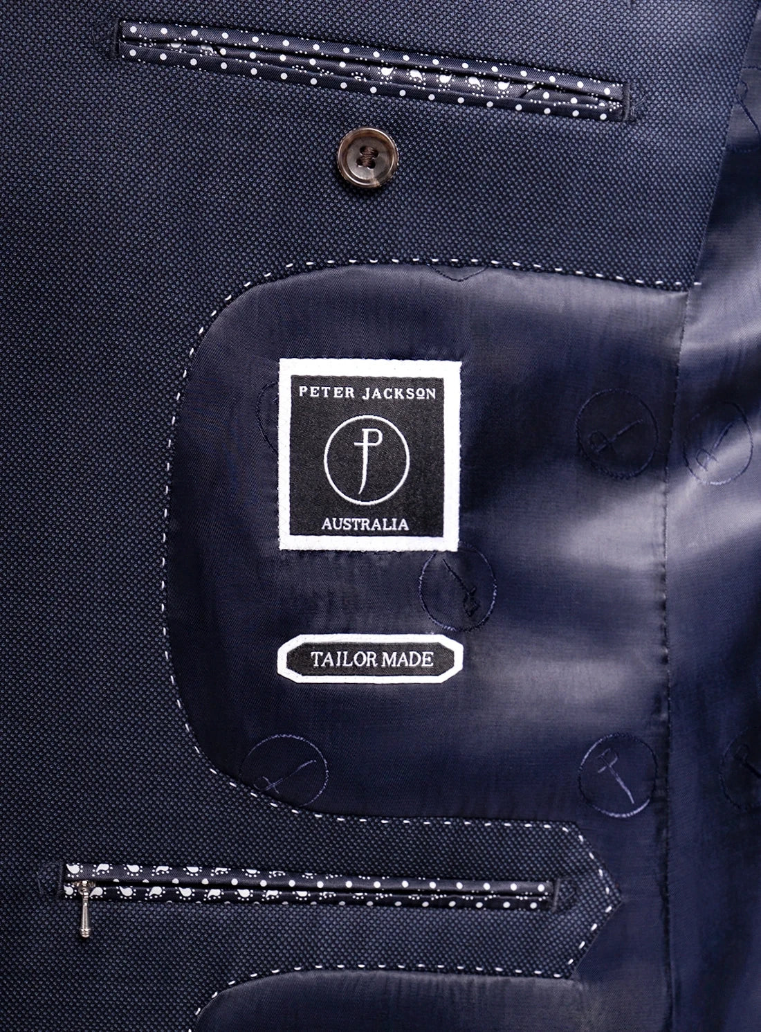 Navy blue suit jacket with 'Peter Jackson Australia' label
