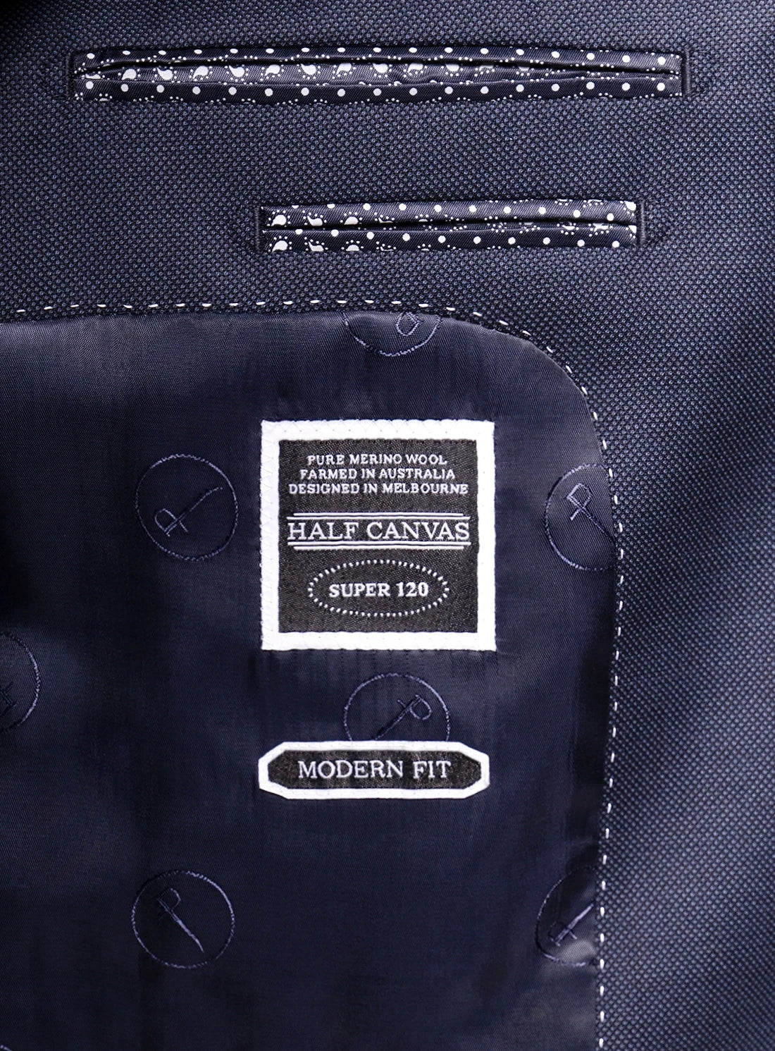 Label on a navy suit jacket indicating 'Half Canvas' label and 'Modern Fit'.