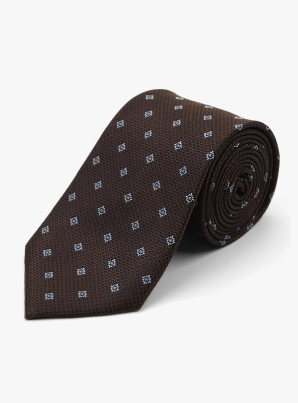 Brown tie with a subtle pattern on a white background