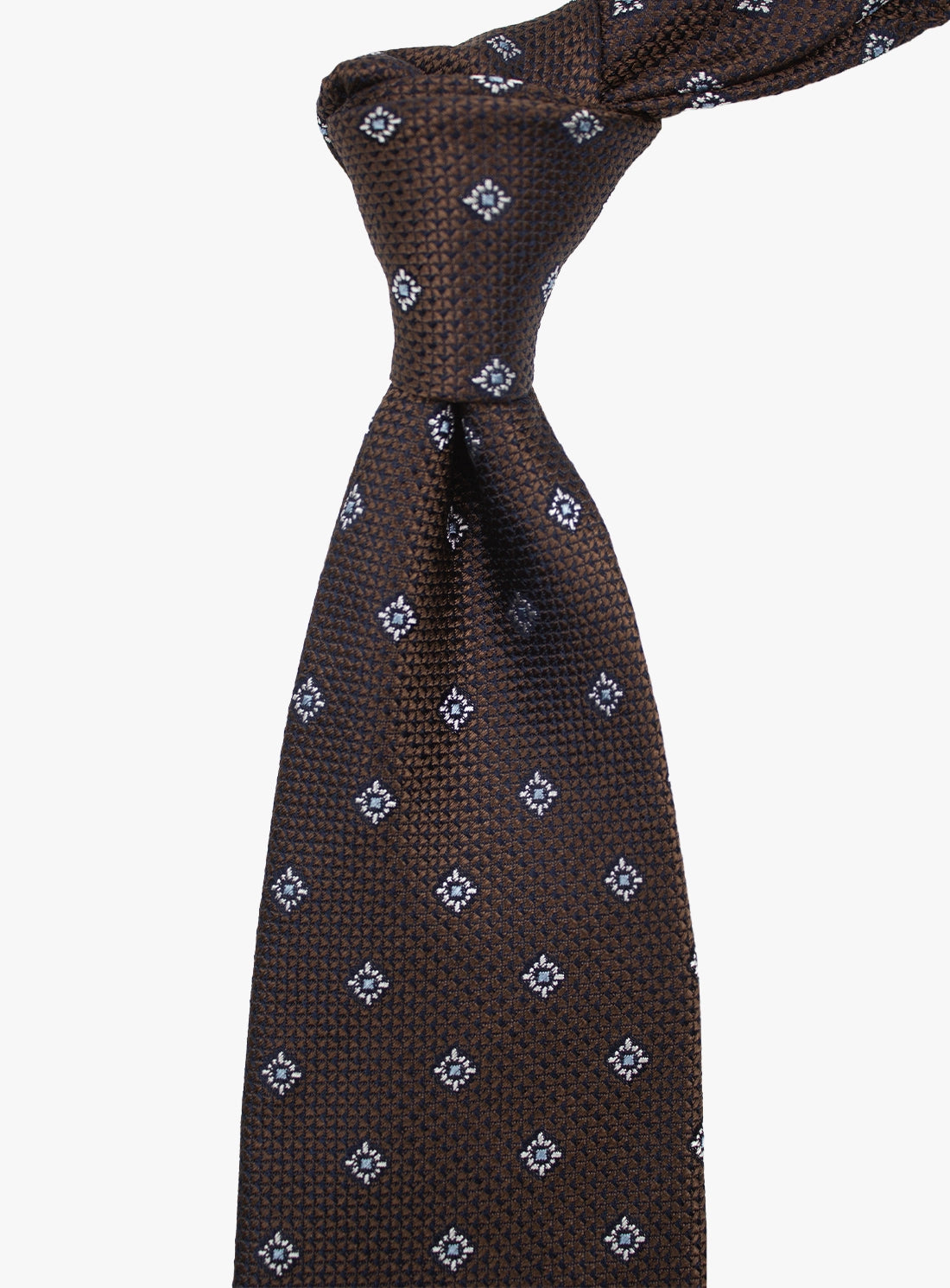 Brown patterned tie on a white background