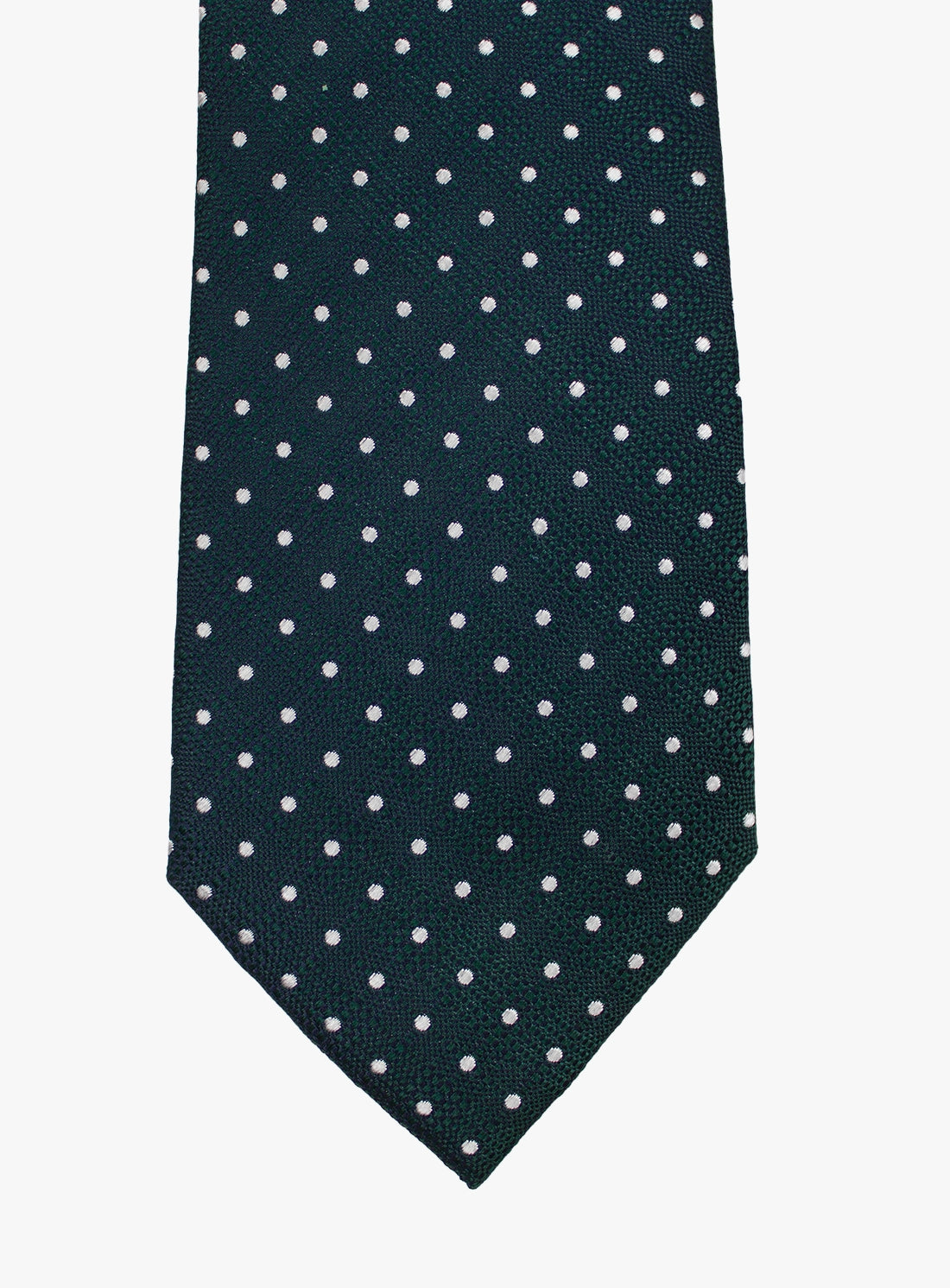 Navy blue tie with white polka dots on a white background