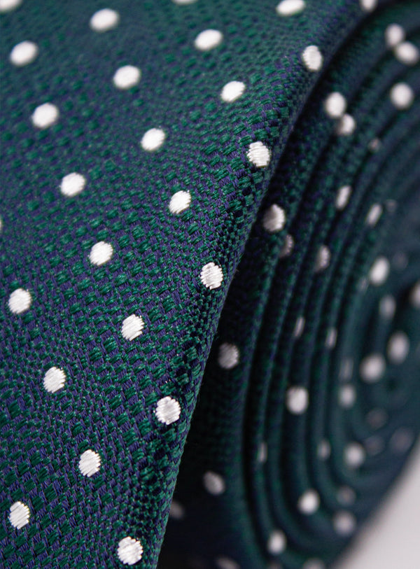 Close-up of a green tie with white polka dots