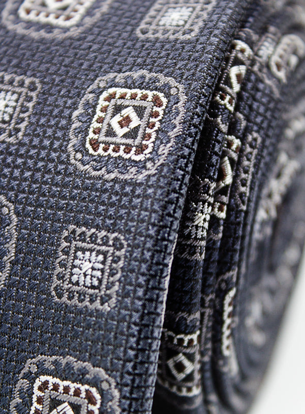 Close-up of a blue patterned fabric with intricate designs.
