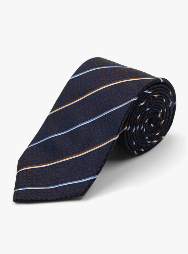 Navy striped tie on a light gray background
