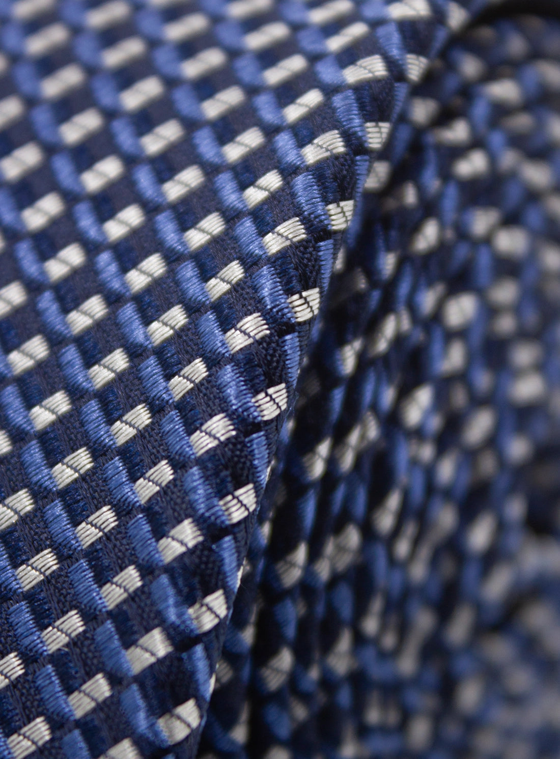 Close-up of a blue and white checkered fabric texture