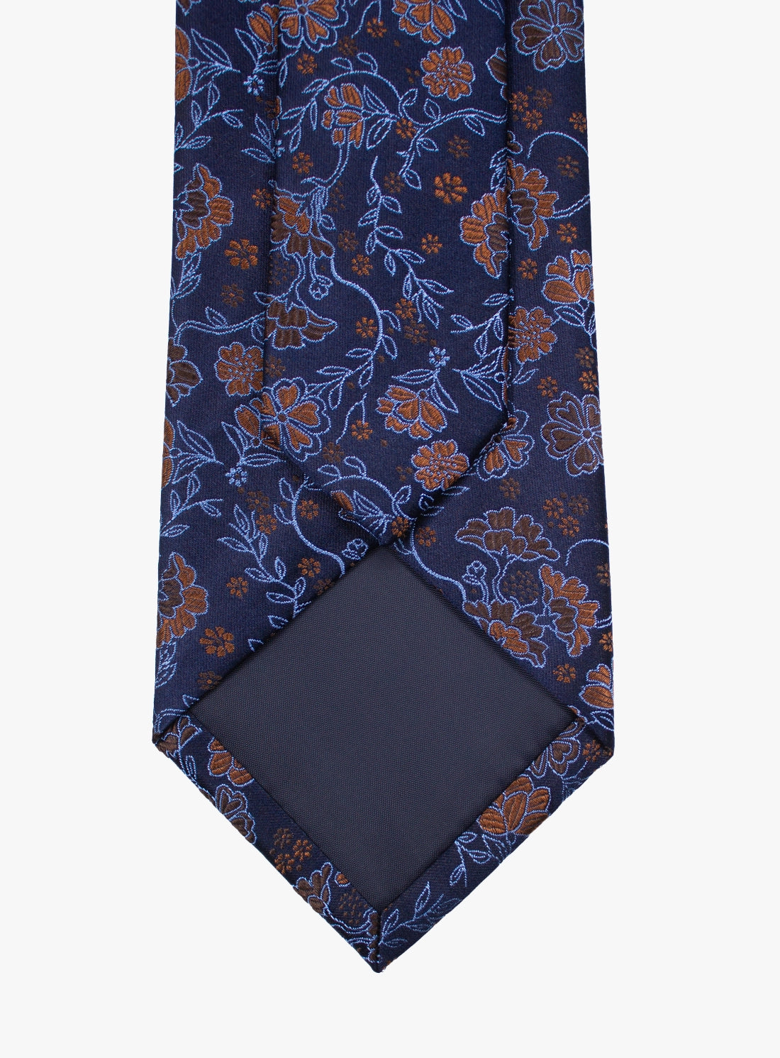 Navy blue floral patterned tie with matching pocket square on a white background