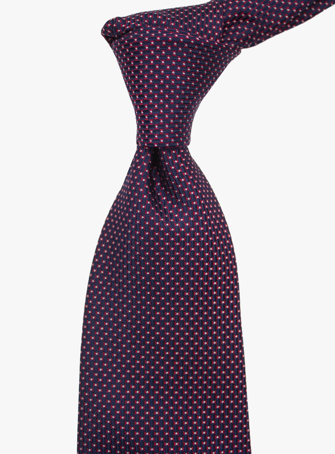 Close-up of a patterned purple tie on a white background