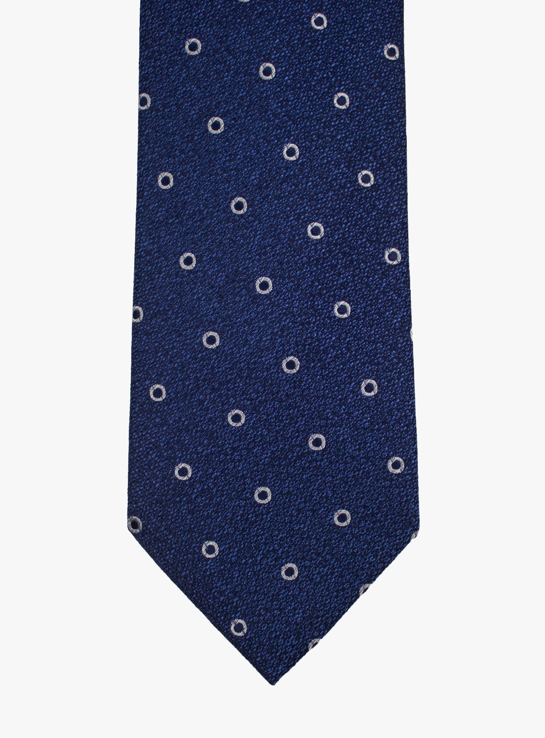 Navy blue tie with white circular pattern on a white background