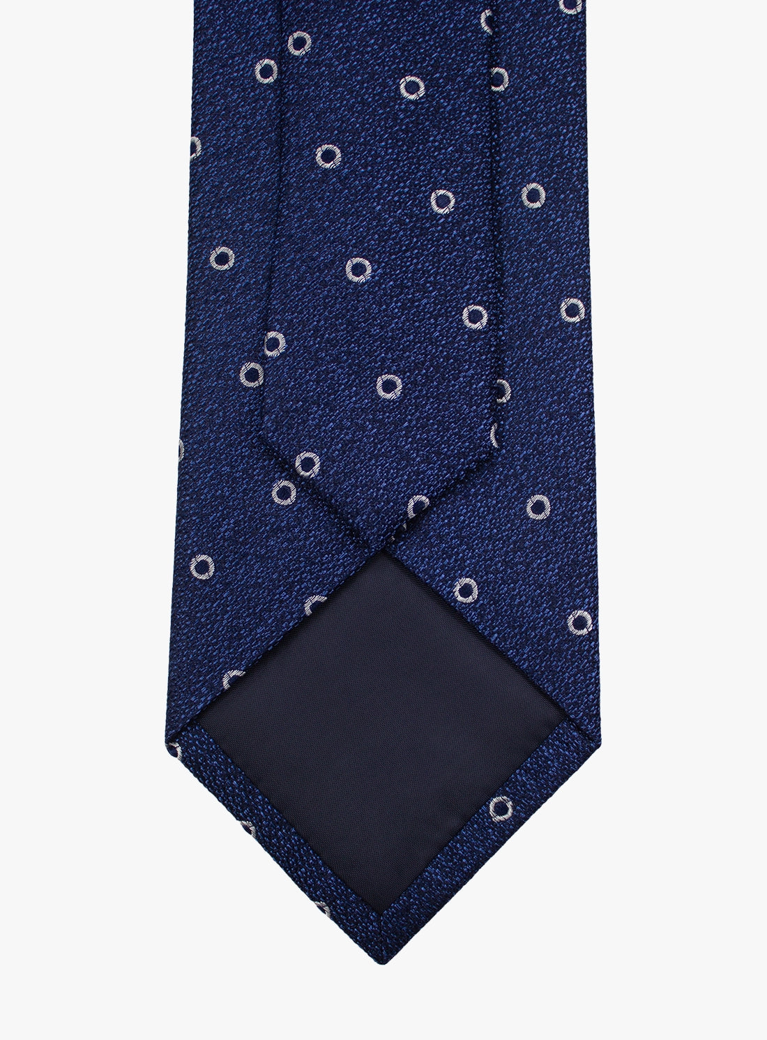Navy blue tie with white circular pattern on a white background