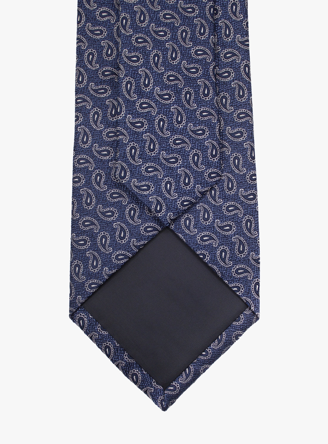 Blue paisley patterned tie on a white background