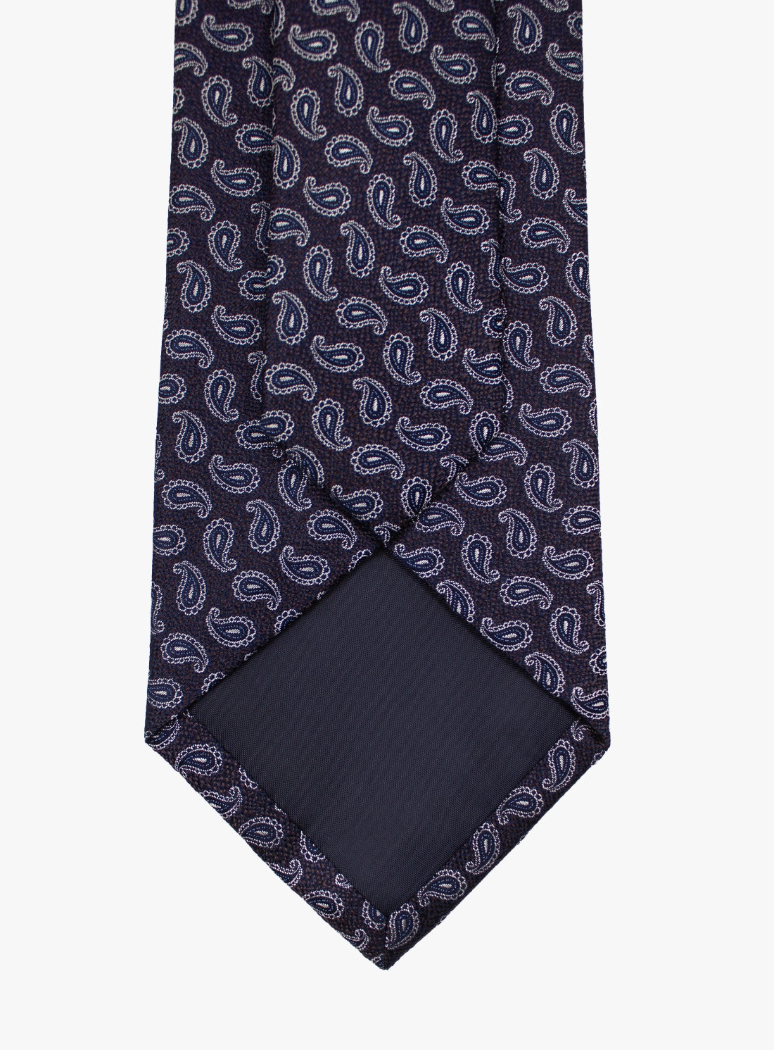 Navy blue tie with white paisley pattern on a white background