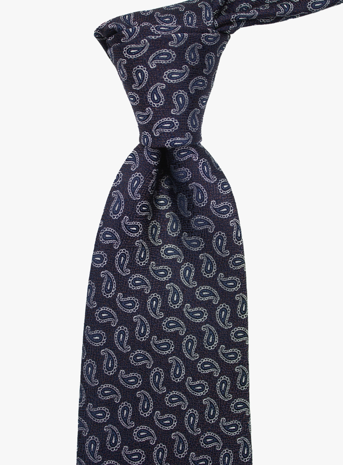Navy blue tie with white paisley pattern on a white background