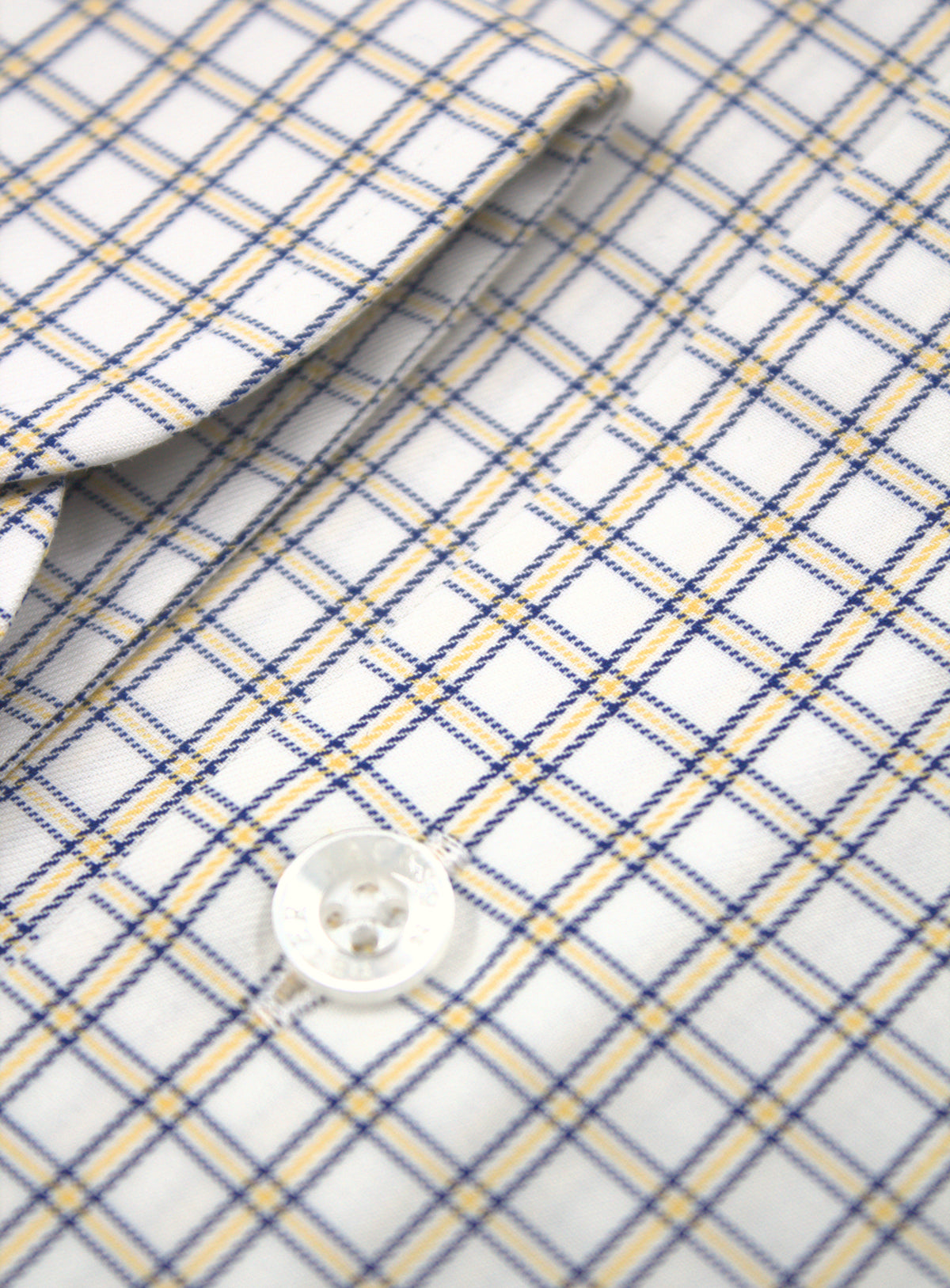 Rounded barrel cuff and sleeve detail of Milan yellow mini plaid shirt