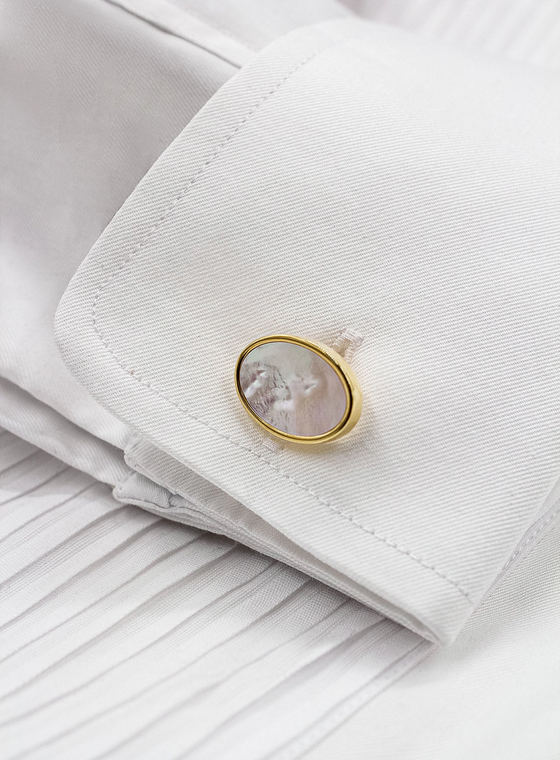 oval gold with mother of pearl cufflinks in shirt