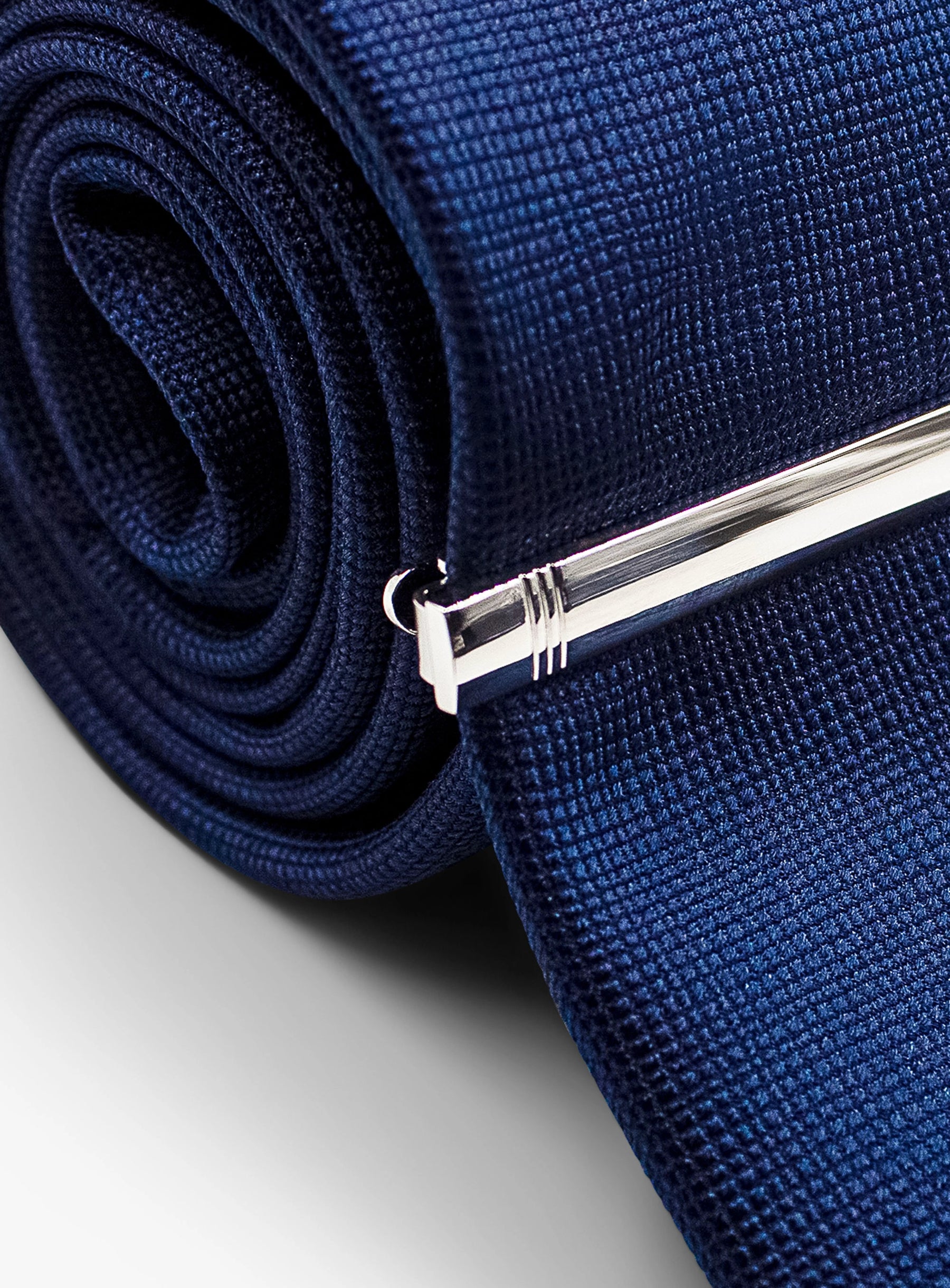 silver detailed tie bar on tie