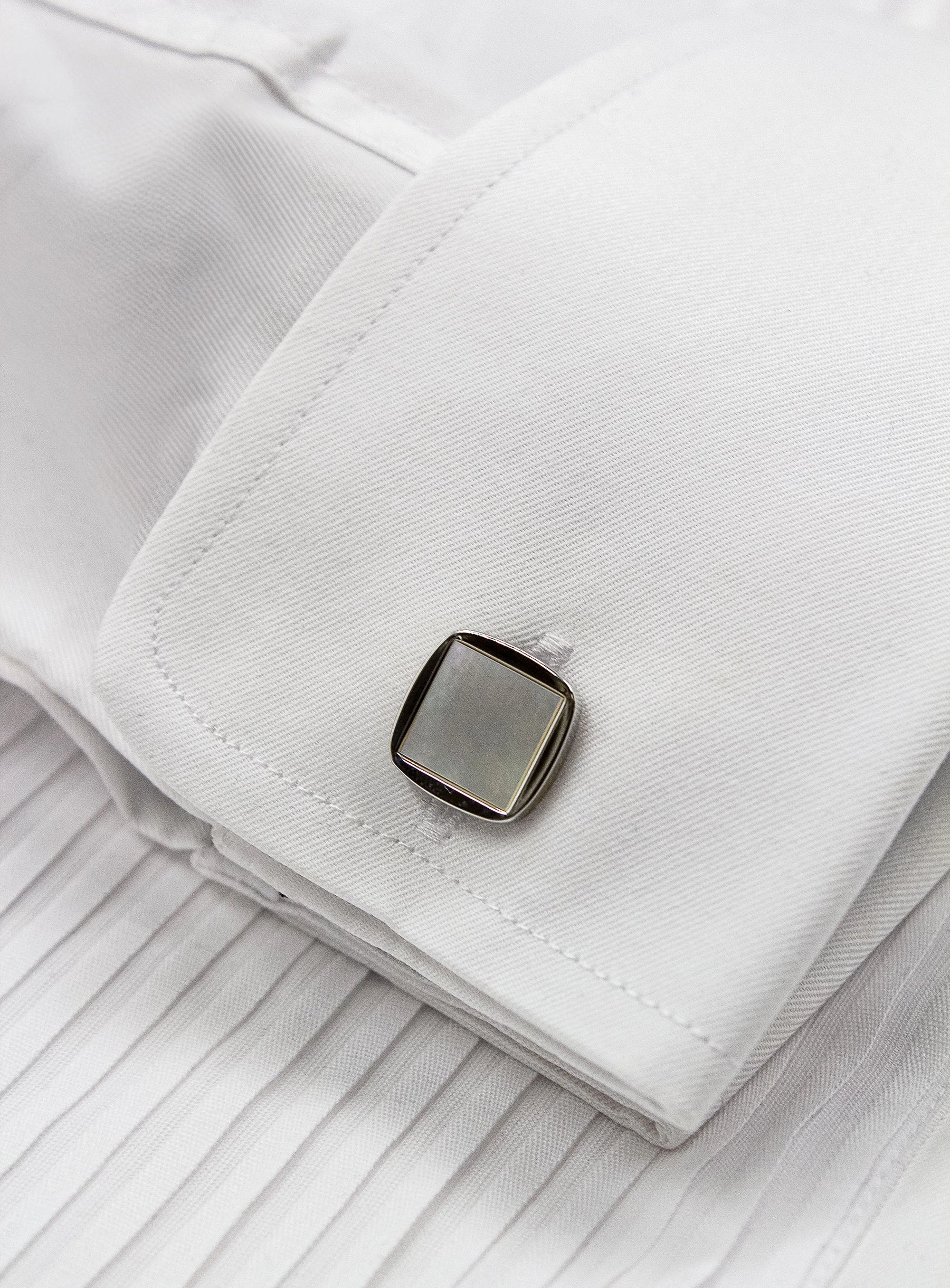 square silver with mother of pearl cufflinks in shirt